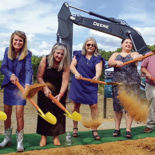 Josh and Lauren Sprayberry (left) were joined by family members in a ceremonial groundbreaking last Thursday for the Len Resort &amp; Residences, slated for completion in May 2026 on the Putnam County shores of Lake Oconee. IAN TOCHER/Staff