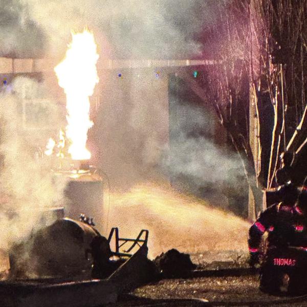 The fire burns off the gas leaking from the propane tank. CONTRIBUTED