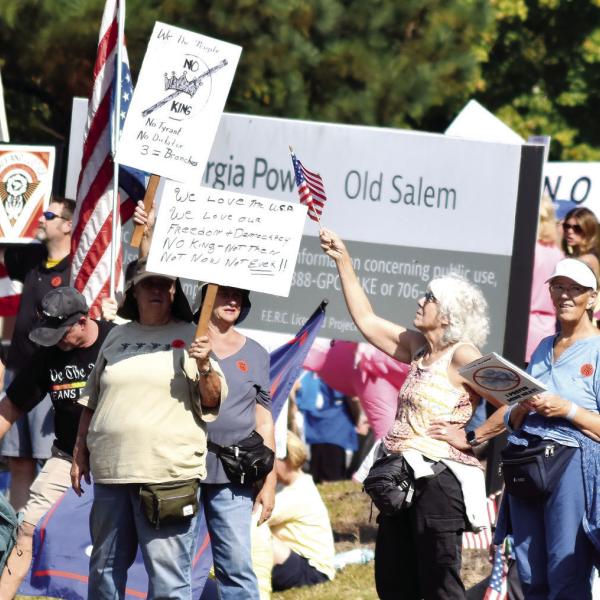 Opponents of Donald Trump’s policies gathered near the intersection of Hwy 44 and Linger Longer Road Oct. 18 to express their dissatisfaction. T. MICHAEL STONE/Staff