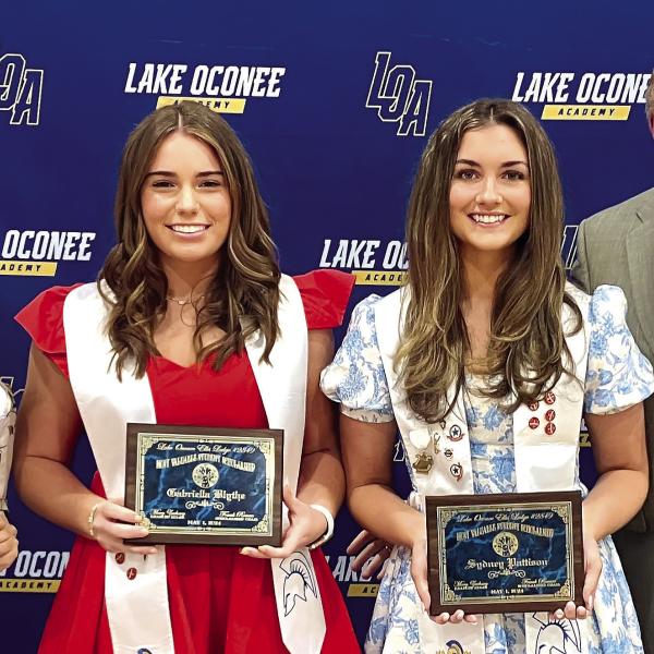 Frank Rowan, Lake Oconee Lodge scholarship chair, presents awards to (L-R) Ridhadhi Sukha, Gabriella Blythe and Sydney Pattison. CONTRIBUTED
