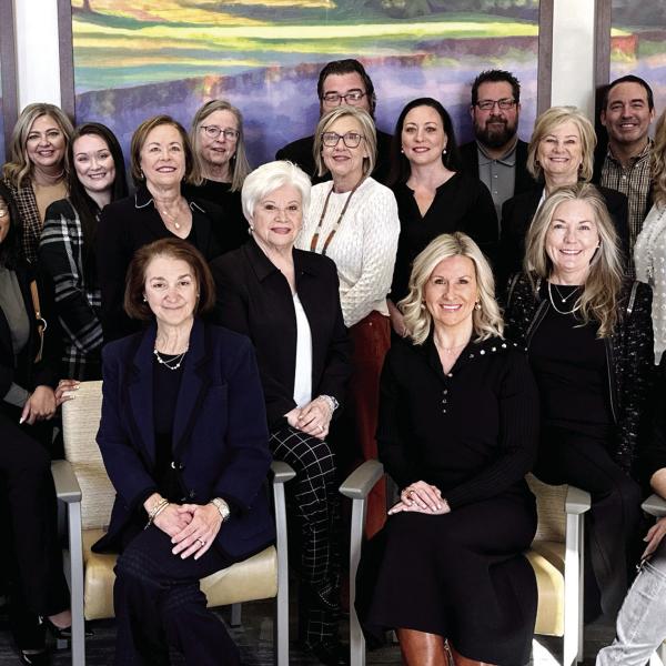 Members of the Heart and Soul Gala Committee, including event chair Riezl Baker (far left), pose with members of the Reynolds Properties team in the operating room waiting area at St. Mary’s Good Samaritan Hospital. CONTRIBUTED