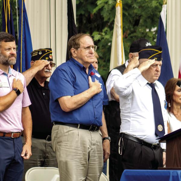 Several leaders from Madison and Loganville pay tribute to fallen soldiers as “Taps” plays near the ceremony’s conclusion. SKYLA MORRIS/Staff