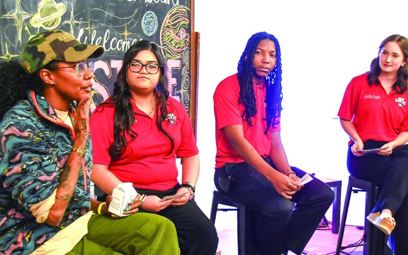 Author Nic Stone (left) began by answering questions in a moderated forum led by PCHS students (l-r) Shayla Carrasco-Pelayo, Larry Richardson, and Addie Grace Usry. IAN TOCHER/Staff