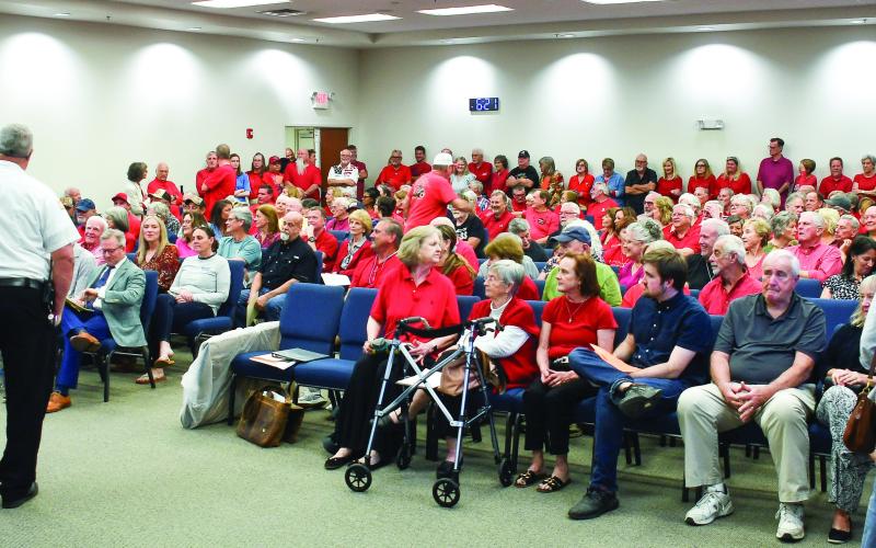 Putnam County Fire Chief Thomas McClain stands beside the podium after he delivered the news that up to 40 citizens attending a Planning &amp;amp; Zoning meeting had to wait outside the large room at the county’s administration building. IAN TOCHER/Staff