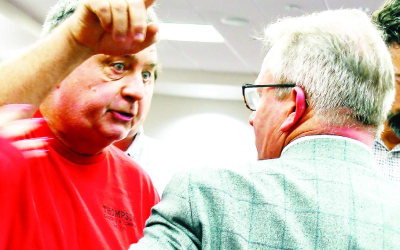 Putnam County resident Mark Thompson addressed Jay Putnam County Stone lawyer Jay Dell as the P&amp;Z meeting broke up last Thursday night. IAN TOCHER/Staff