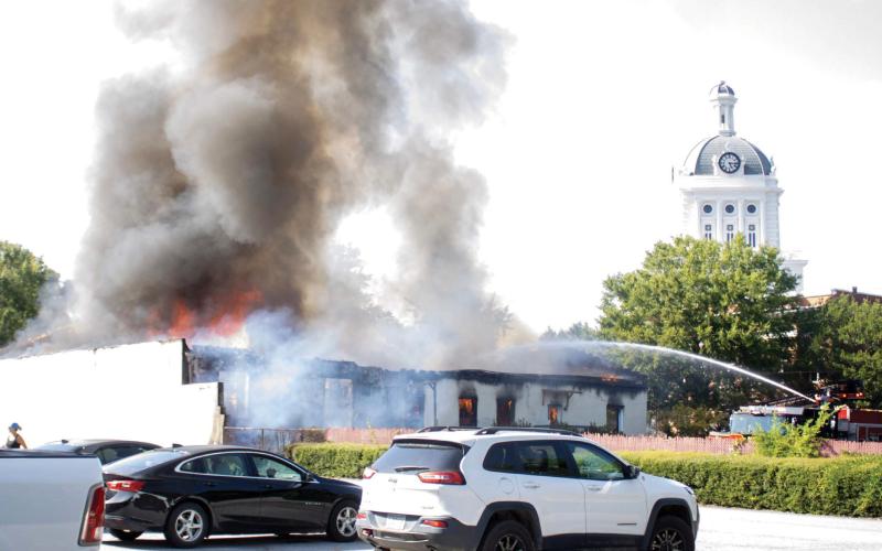 Thanks to hard work by firefighters, the historic Morgan County Courthouse in the background was spared any damage from the fire. SKYLA MORRIS/Staff