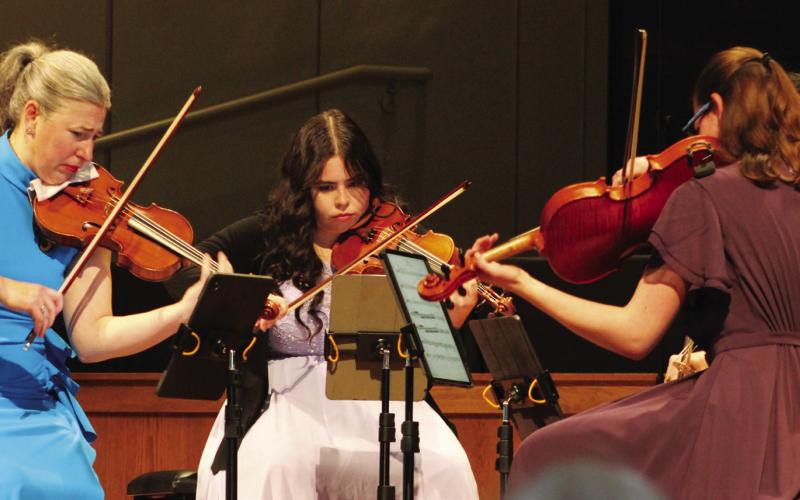 Violinist Amy Schwartz Moretti (left) led the way for Holly Parker (center) and cellist Raman Ramakrishnan during OPAS Unplugged last Sunday.