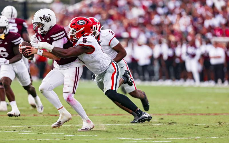 Georgia inside linebacker Raylen Wilson (5) attempts to bring Mississippi State quarterback Blake Shapen to the ground. (Courtesy of UGA Athletics)