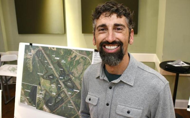 Hans Dawson displays the site plan for the proposed quarry. IAN TOCHER/Staff