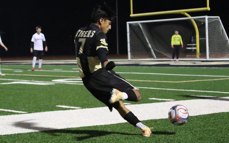 Greene County’s Levny Castillo lines up, preparing to attempt a shot on goal in a recent match. TREY NORRIS/Staff