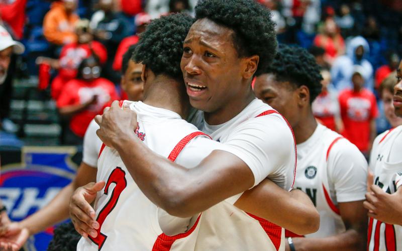 Locus was emotional after the win, hugging a teammate while tears roll down his face. LANCE McCURLEY/Staff