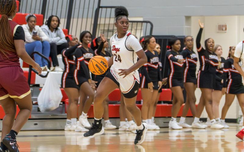 Cyndey Burke brings the ball up the floor for the Lady Dogs during a game earlier this season. SKYLA MORRIS/Staff