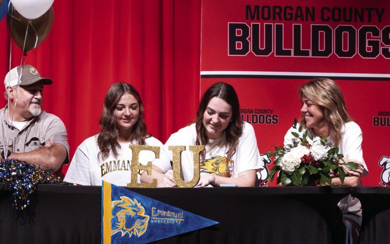Abby Dennard signs with Emmanuel University, a private Christian college in Franklin Springs, Ga., in a ceremony at MCHS last week. SKYLA MORRIS/Staff