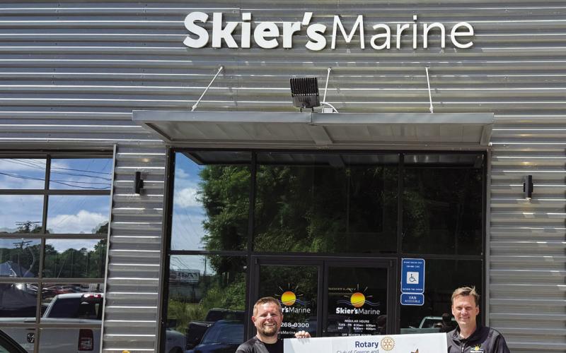 Prize sponsor representatives Luke Fletcher and Brandon Lane, Skier’s Marine. Prize winner, Tamara Dobson, was unavailable for this photo. CONTRIBUTED