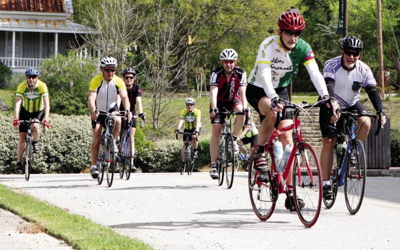 Riders pedal into downtown Union Point during a past Ticket to Ride event. This year, Union Point will host its start, finish, and SAG location at Union Pharmacy, including food trucks from 11 a.m. to 2 p.m. CONTRIBUTED