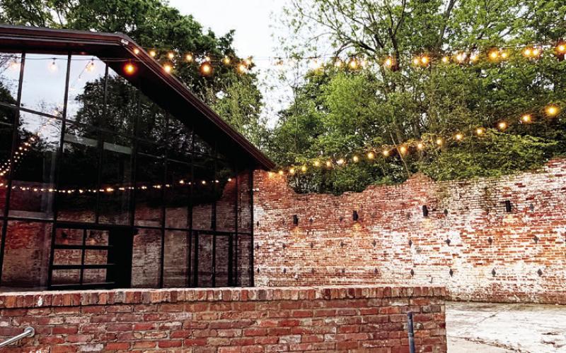 The courtyard at the former Oconee Brewing Company offers an outdoor experience for patrons of the new Barrel &amp;amp; Rail venue in downtown Greensboro. MAUREEN STRATTON/Staff