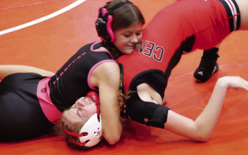 Morgan County’s Airyanna Klinger (left) works for a pin during a match earlier this season. Klinger placed sixth in her weight class at last week’s state traditional meet, becoming the first female wrestler in program history to do so. JATAVIOUS WARD/Contributed