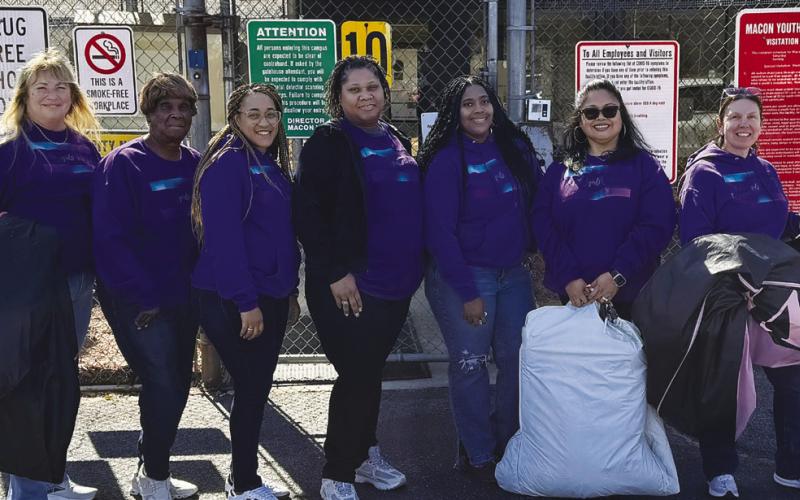 Reasha Daniels (third from right) and several other Putnam County women recently visited a youth detention center for girls in Macon to distribute dresses for a Valentine’s Day dance. CONTRIBUTED