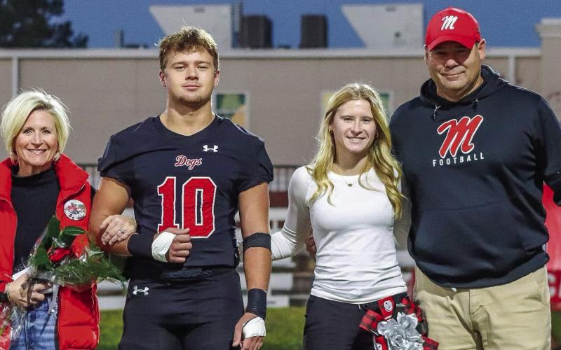 The Jenkins family poses for a photo on Morgan County football’s Senior Night last season. CONTRIBUTED