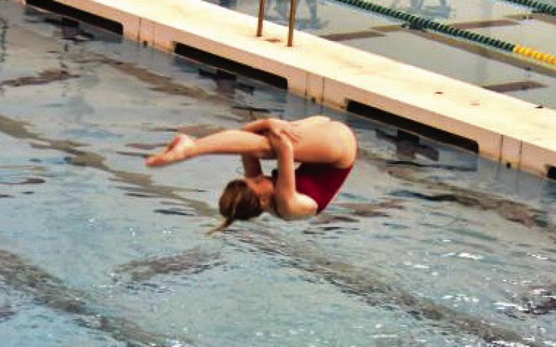 Caroline Jenkins tries to complete a tuck dive during the GHSA 2024 swimming and diving state championship meet. CONTRIBUTED