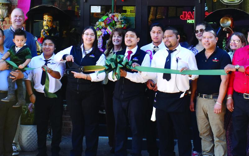 Paulina Macias is joined by Jalisco Mexican Grill staff, Mika Mills of the Greene County Chamber of Commerce, chamber members and supporters of the popular Mexican restaurant as it celebrates its 10th anniversary at Lake Oconee with a ribbon cutting. The restaurant also hosted a Business After Hours as a new member of the Greene County Chamber of Commerce. T. MICHAEL STONE/Staff