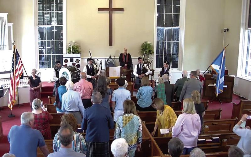 Bagpipers and drummers play a major role during the service. CONTRIBUTED