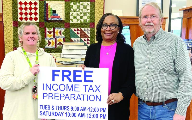 L-R: Greene County Library Branch Manager Tara Coile, Greene County Library Executive Director Targie Folds, and St. Vincent de Paul Vice President Mike Sleeth. CONTRIBUTED