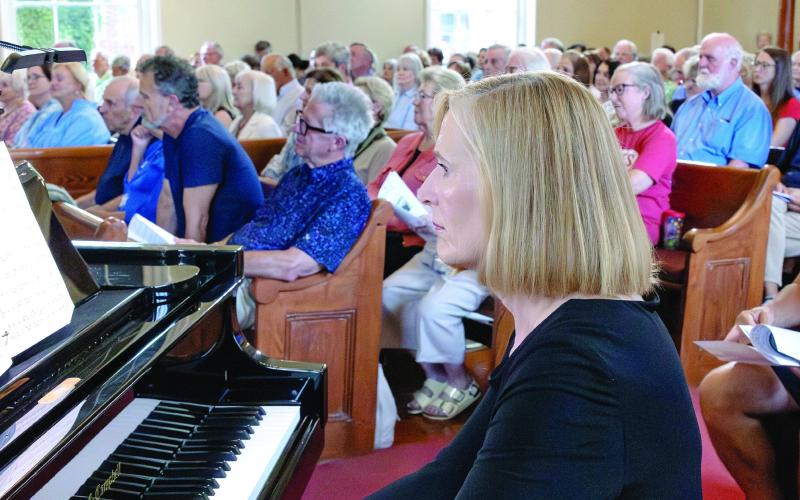 Jana Williams on piano in front of a packed house. LEIGH LOFGREN/Staff