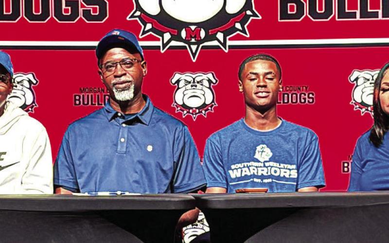 Morgan County senior Jacoby Simmons (second from right) recently signed to continue his basketball career at Southern Wesleyan University in South Carolina. CONTRIBUTED