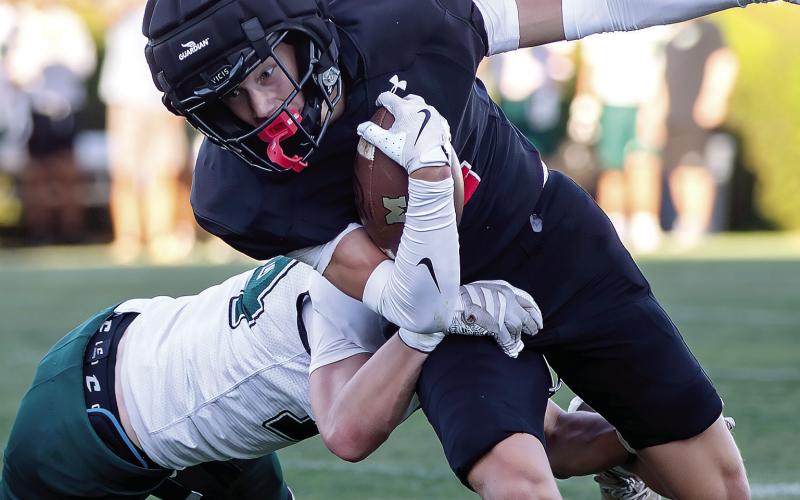 Morgan County receiver Grant Smith (4) attempts to break a tackle. SKYLA MORRIS/Staff