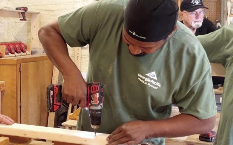 A motivated group of 12 Georgia-Pacific Madison Plywood facility employees recently joined Neighbors Helping Neighbors volunteers to build and deliver new beds for several local children in Greene and Putnam counties. CONTRIBUTED