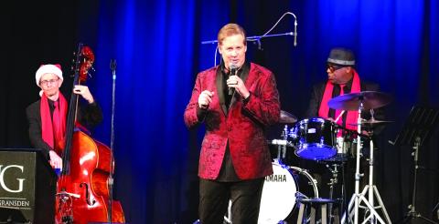 Joe Gransden (center) performs on stage at Greensboro’s Festival Hall. LEIGH LOFGREN/Staff