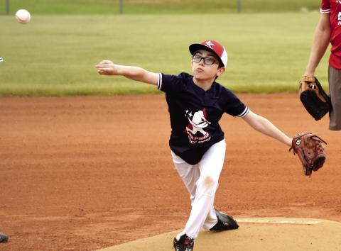 Is that a screwball that youngster just threw? We’ll have to ask Joe Cardwell, a former college pitcher at the University of South Carolina, who was on hand to help coach young ballplayers at Fisch Camp. T. MICHAEL STONE/Staff