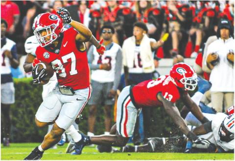 Georgia wide receiver Mehki Mews (87) breaks away from defenders on a 54-yard touchdown during Saturday’s win over UTMartin. CHARLES JORDAN/Contributed