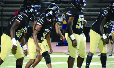 The Greene County defensive front gets ready to blitz the quarterback in a game against Warren County earlier this season. BRENDAN KOERNER/Staff