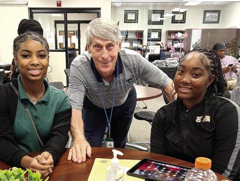 TEF founder Dave Thillen pictured with seniors MaRyah West and Aleyah Redd. CONTRIBUTED
