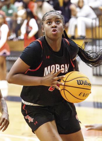 Morgan County senior Cydney Burke, the team’s second-leading scorer last season, drives the lane in a scrimmage against Cedar Shoals on Nov. 4. SKYLA MORRIS/Staff