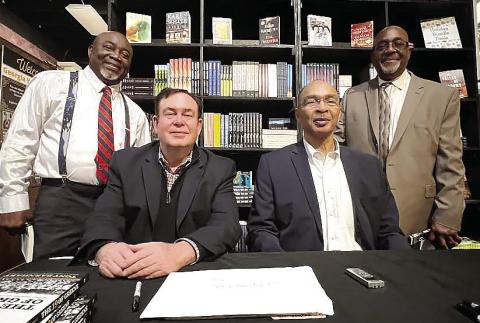 L-R: “Sweet” Lamar, author Tony Barnhart, Charles Turner and Darryl Farley were all members of The 19 of Greene, the first integrated football team in Greene County High School’s history. IAN TOCHER/Staff