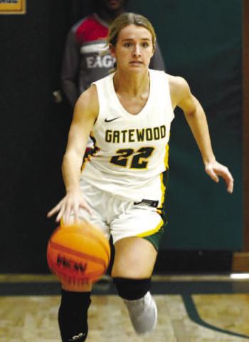 Senior Anna Williamson (22) drives the ball up the court in a game against Young Americans Christian earlier this season. IAN TOCHER/Staff