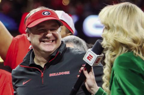 Georgia head coach Kirby Smart is all smiles during an interview with ESPN reporter Laura Rutledge after winning the SEC Championship game in Atlanta on Saturday. LANCE McCURLEY/Staff