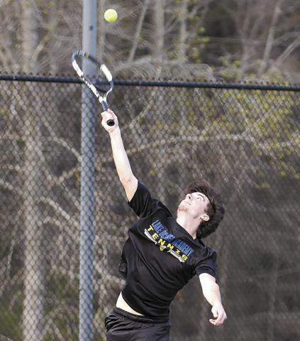 Lake Oconee Academy senior Henry Hynes prepares to serve during a match earlier this season. SKYLA MORRIS/Staff