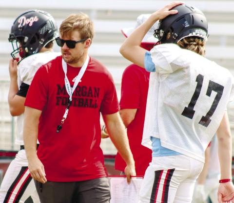 Morgan County offensive coordinator Brett Bell during drills at spring practice on Monday, May 8. LANCE MCCURLEY/Staff