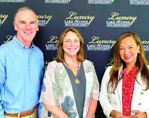 Luxury Lake Oconee’s Ted Baker with Karen Salter (center) and Riezl Baker will handle the sales and marketing of Blue Heron Cove Lake Oconee. CONTRIBUTED