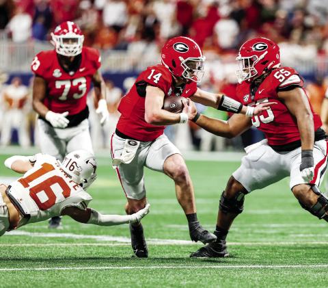 Gunner Stockton (14) is a bigger threat in the quarterback run game than his predecessor, Carson Beck, giving opposing defenses more to plan for. COURTESY OF UGA ATHLETICS