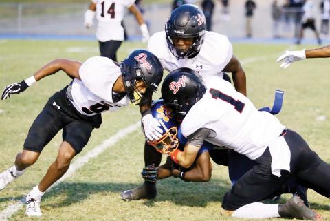 A trio of Morgan County defenders brings down a Cedar Shoals ball carrier during a win over the Jaguars on Sept. 13. (JIM TURNER/Contributed)