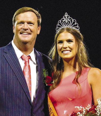 Mary Cate Strickland (right) was named Morgan County's Homecoming queen on Friday night. She was accompanied by her father. LANCE MCCURLEY/Staff