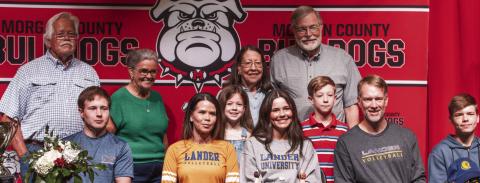 Backed up by supportive family members, Morgan County senior Camryn Scherer (center, grey shirt), is enthusiastic about continuing her scholastic and athletic careers at Lander University in South Carolina. SKYLA MORRIS/Staff