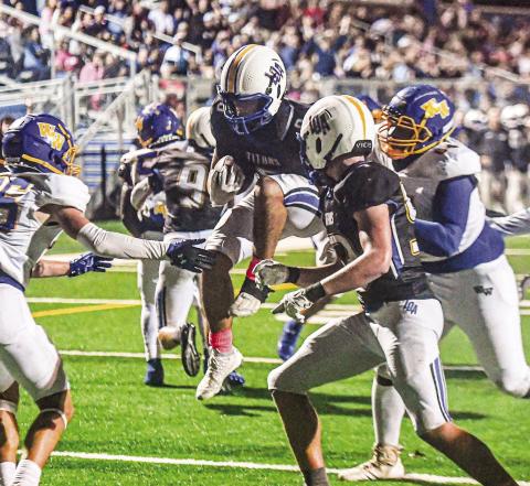 LOA senior running back Cameron Kelley (8) scored a late touchdown last Friday, but it wasn’t enough to punch a ticket to the playoffs. CHARLES JORDAN/Staff