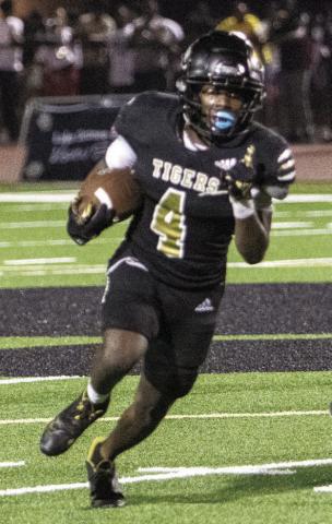 Greene County running back Travez Gibson (4) breaks free and rushes for a first down in a game against Putnam County on Aug. 16. The junior rushed for two of the Tigers’ three touchdowns in last Friday’s loss at Lincoln County. LANCE McCURLEY/Staff