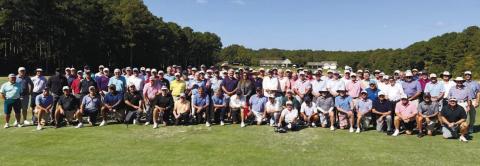 Jennifer Vaughan of Ansley Real Estate Christie’s International (center) is surrounded by the entire playing field for the Georgia Senior PGA at Reynolds Lake. CONTRIBUTED